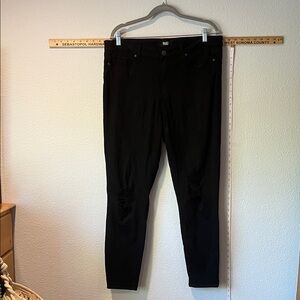 Paige black denim jeans with distressed knees. Size 34.